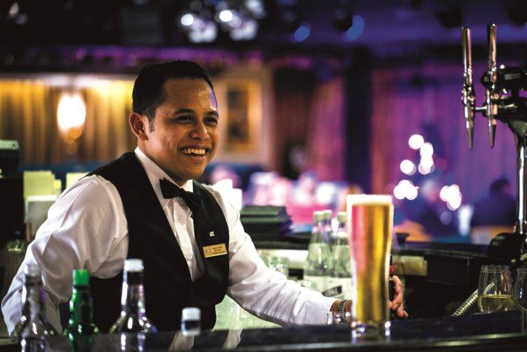 Waiter in Neptune Lounge bar  - pint of beer